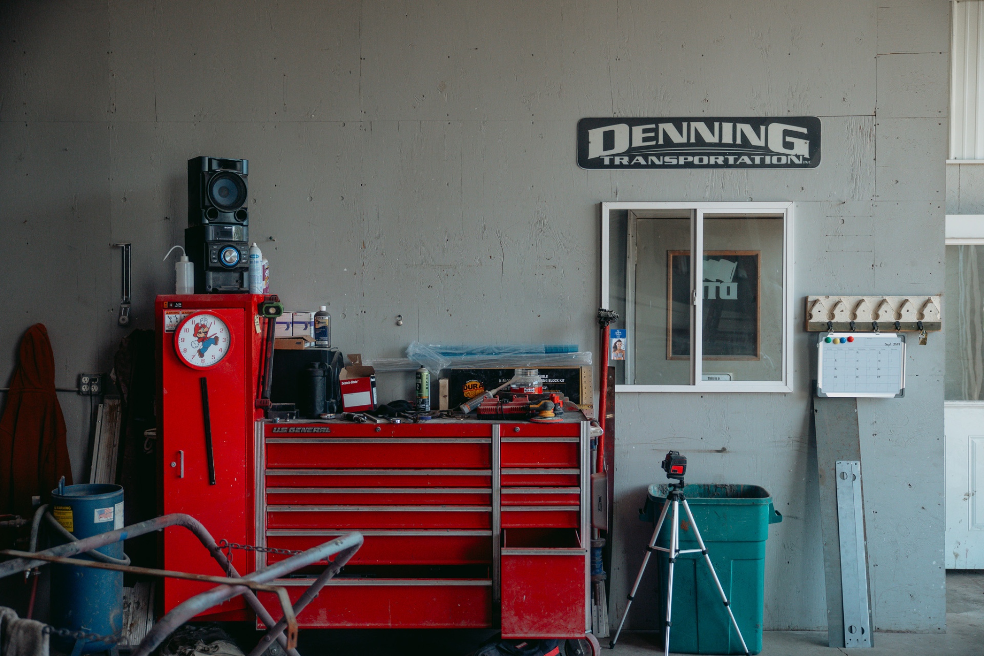 Denning Transportation sign and red tool chest